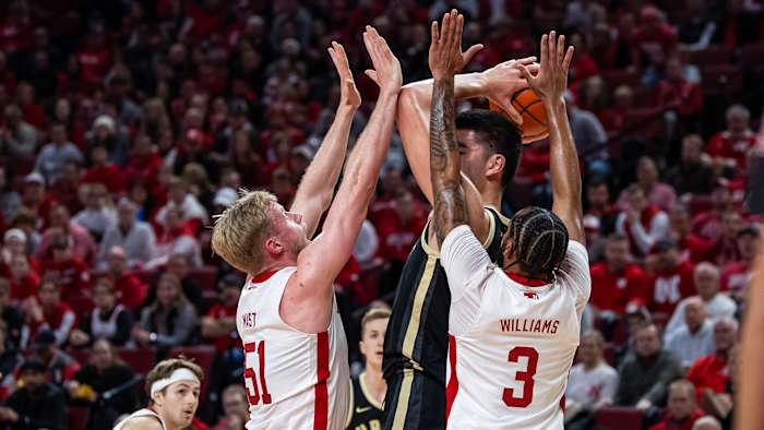 Rienk Mast and Brice Williams defend against Purdue big man Zach Edey.